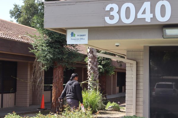 An employee walks into the RH Community Builders corporate office at 3040 N Fresno Street on Sept. 19. 