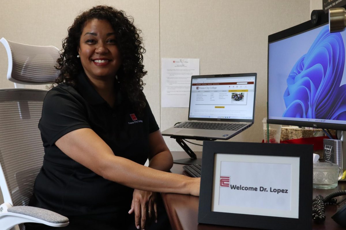 Kizzy Lopez sits at her Desk inside Psychological Services on Sept.19.