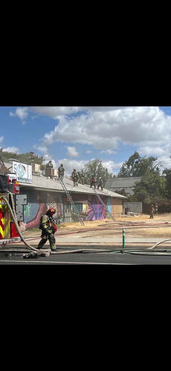 Crewmembers for the Fresno Fire Department are shown putting out a fire that broke out behind three local businesses near the Tower District of Fresno this afternoon. The cause of the fire has yet to be determined, but Van Ness Avenue was closed between Home and Floradora Avenues for approximately two hours. Taken on Sept. 16.
