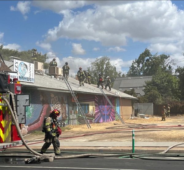 Crewmembers for the Fresno Fire Department are shown putting out a fire that broke out behind three local businesses near the Tower District of Fresno this afternoon. The cause of the fire has yet to be determined, but Van Ness Avenue was closed between Home and Floradora Avenues for approximately two hours. Taken on Sept. 16.
