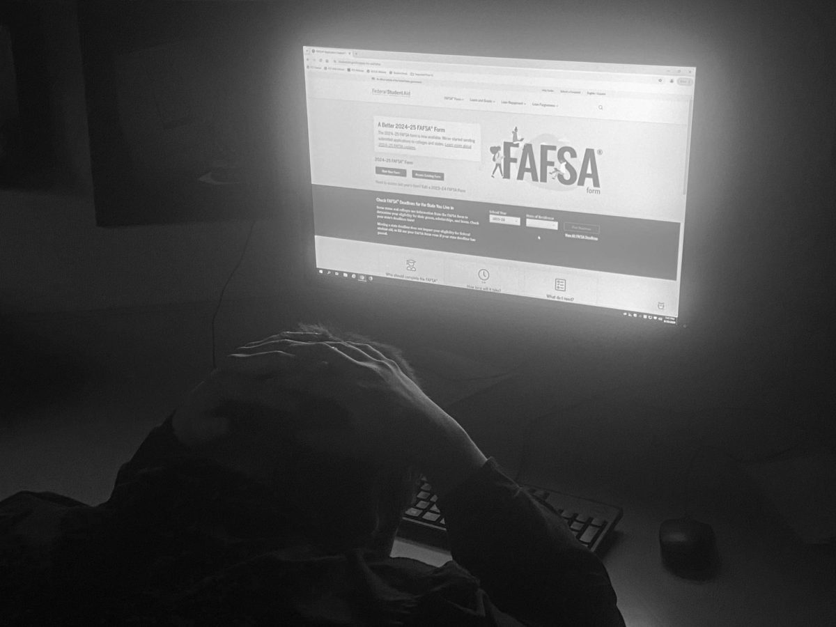 A Fresno City College student poses and struggles with the FASFA form on Sept.
20.