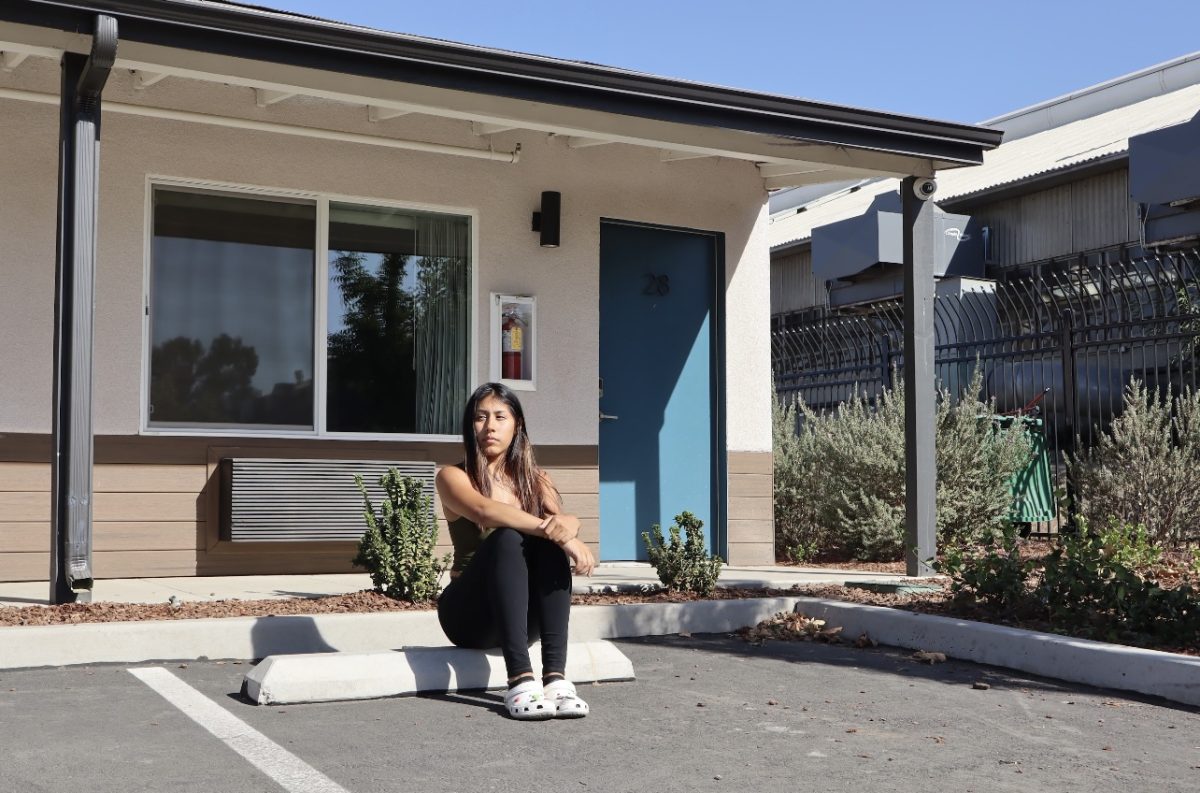 Fresno City College student reporter Brisa Serna poses in front of her previously Homeless and Housing Insecurity Pilot Program (HOPE) granted apartment on Sept. 10. 