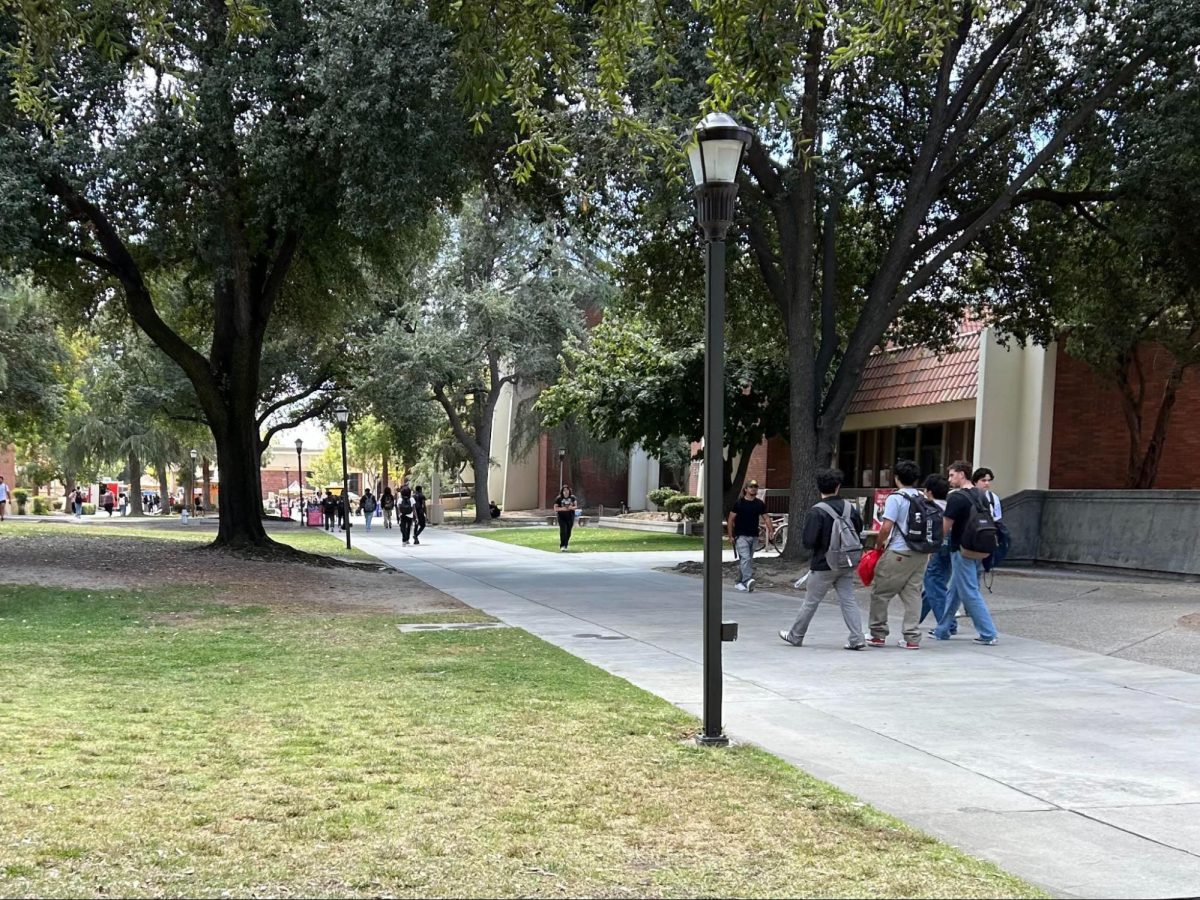  A group of students walking across campus talking to each other on Sept. 16.