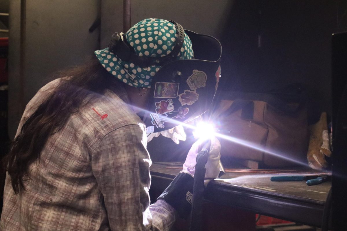 Marilyn Munoz tacks together pieces of practice tubing using TIG welding in the applied technology building on Oct. 22.