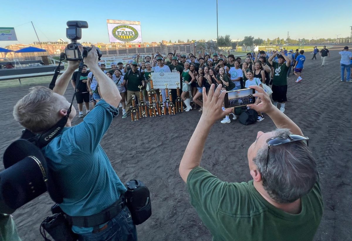 Dinuba High School wins the high school grand sweepstakes again, scoring first in the drum major competition, in tall flags, and in the percussion category. 
