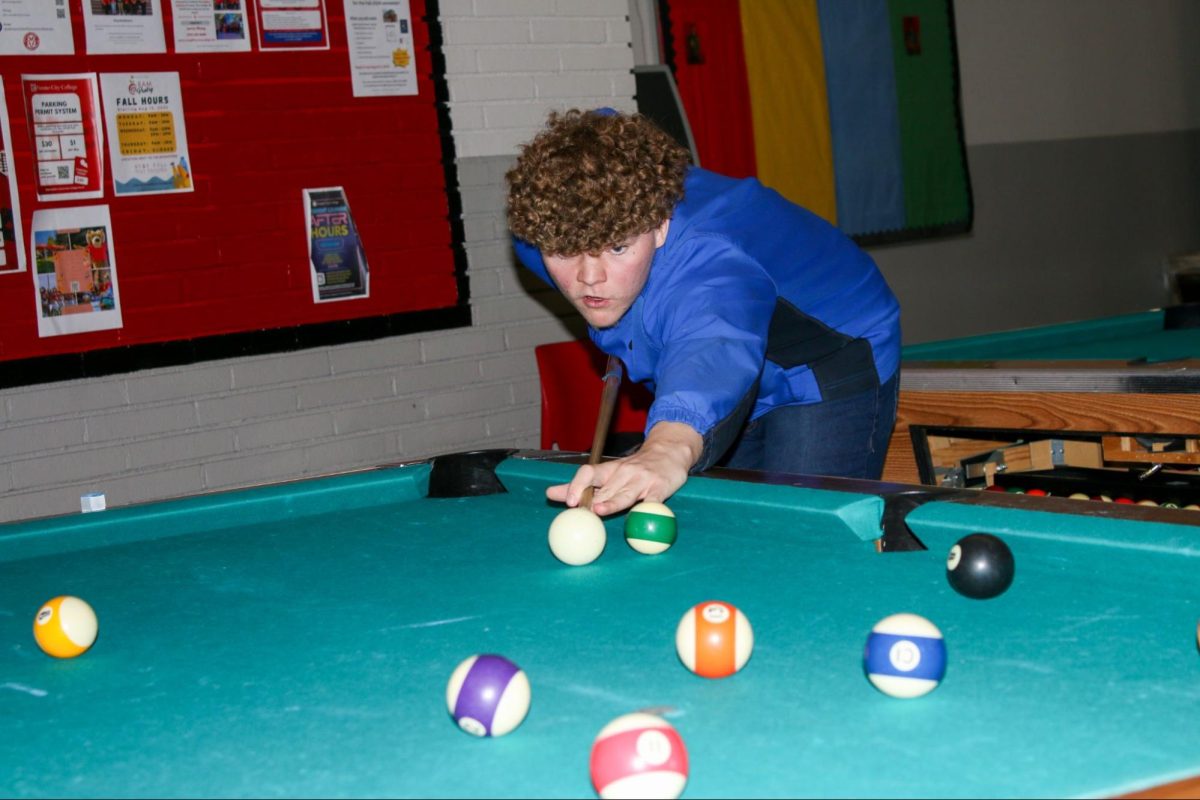  Kendall Greer getting ready to hit one of the stripe balls as he concentrates on winning this part of the finals on Oct. 29.