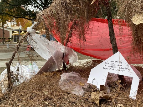 An unhoused encampment art piece made by students of the ART-4 class includes a statistic on the homeless student population in Fresno. Photo taken on Nov. 22.