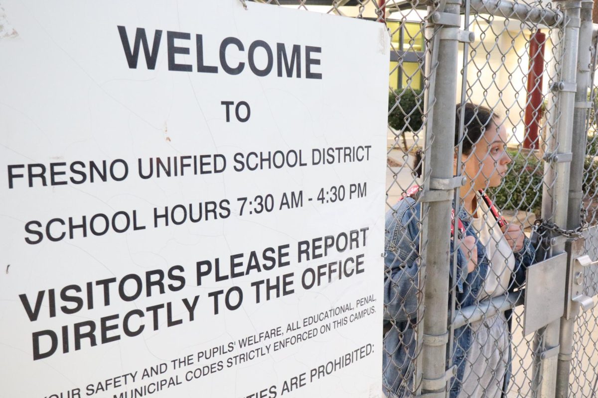 Sarah Hernandez poses inside the gates of a Fresno Unified school
on Nov. 20. 