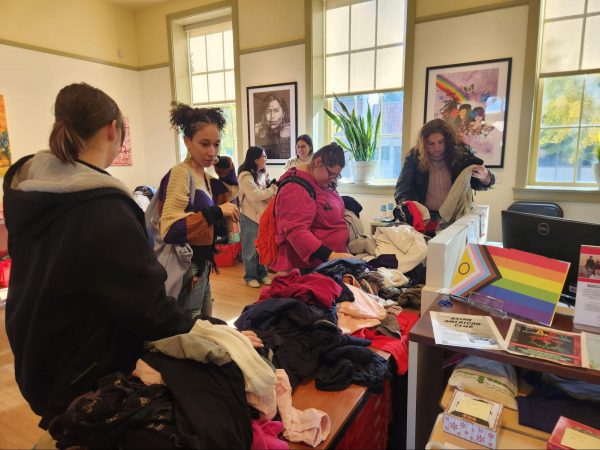 Students browse through donated clothes during the Queer Closet Exchange inside the Social Justice Center at Fresno City College on Nov. 20. The closet was open on Nov. 19-20 from 9 a.m. to 3 p.m. 