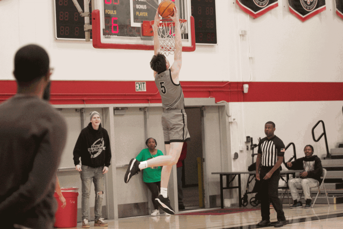 Number 5 Landon Miller dunking the ball against Reedley College on Feb. 19, 2025
