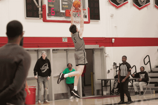 Number 5 Landon Miller dunking the ball against Reedley College on Feb. 19, 2025
